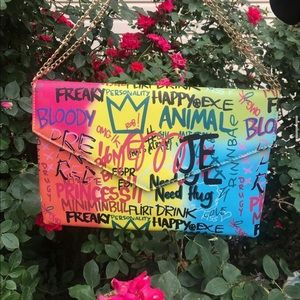 Trendy printed graffiti over the shoulder purse